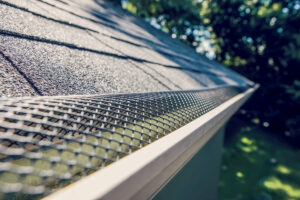 Gutter guard installed onto roofing