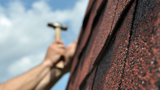 Roofing repair with hammer