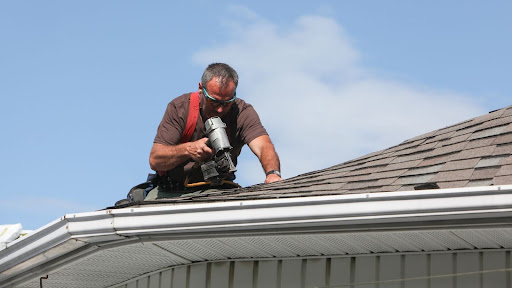Roofing contractor building a roof